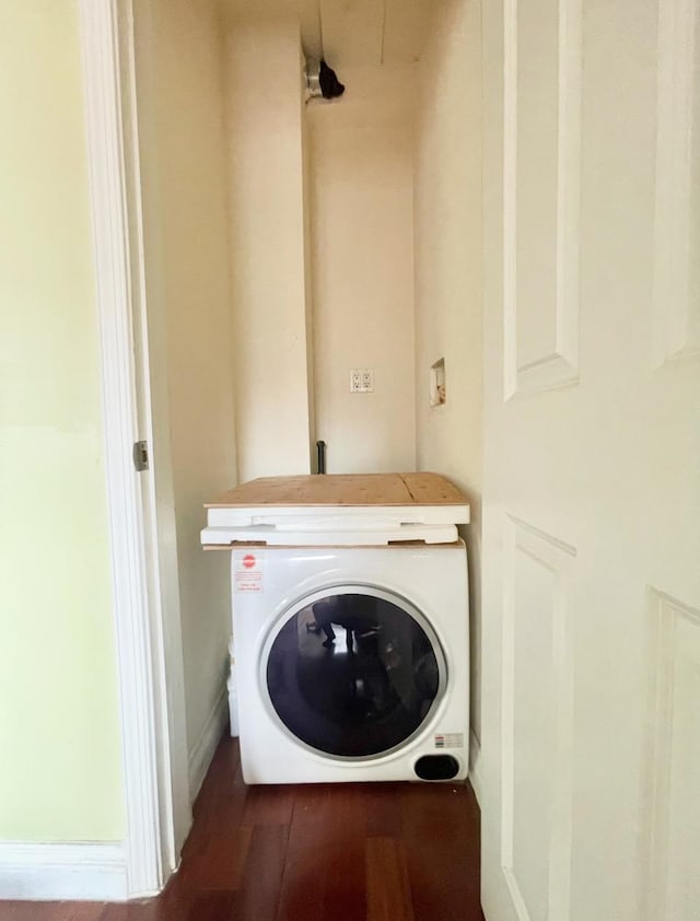 laundry area featuring wood finished floors and laundry area