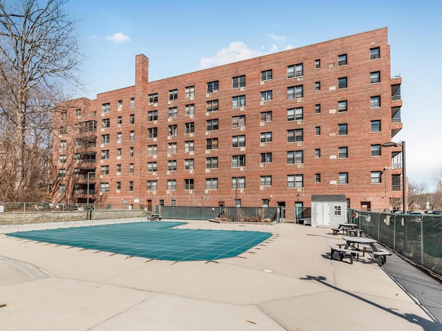 community pool featuring fence