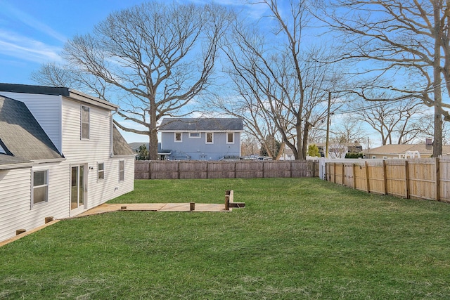 view of yard with a fenced backyard