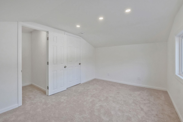 additional living space with recessed lighting, baseboards, carpet, and vaulted ceiling