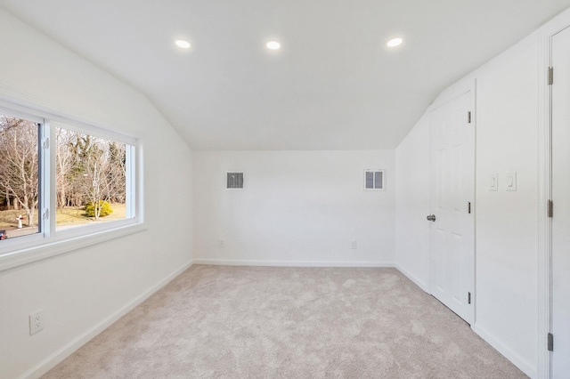 bonus room featuring recessed lighting, baseboards, light colored carpet, and vaulted ceiling