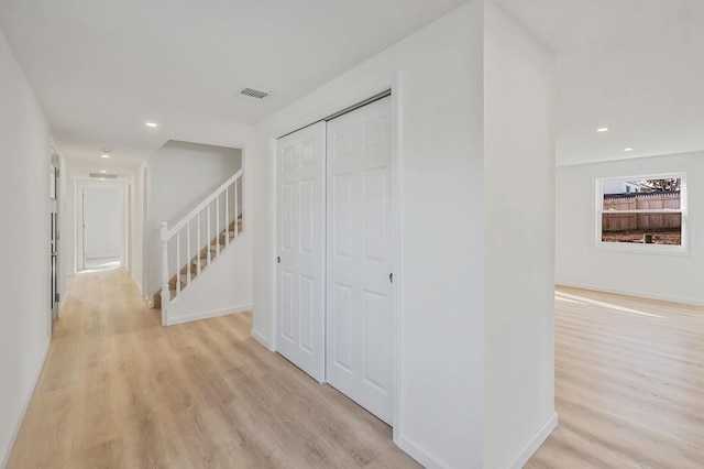 hall with baseboards, recessed lighting, visible vents, and light wood-type flooring