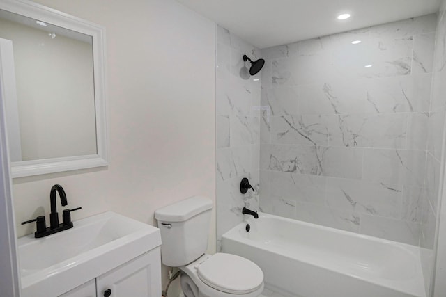 bathroom featuring toilet, vanity, and shower / bathing tub combination