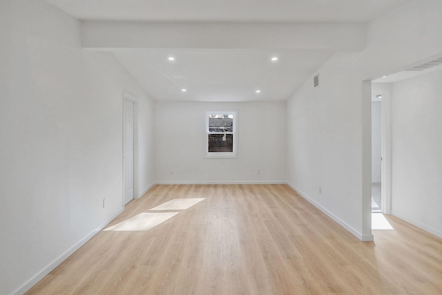 unfurnished room with recessed lighting, light wood-style floors, visible vents, and baseboards