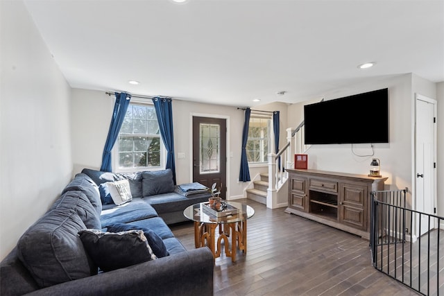 living area with stairway, recessed lighting, baseboards, and dark wood-style flooring