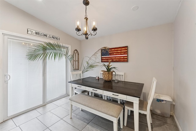 dining area featuring light tile patterned floors, baseboards, an inviting chandelier, and vaulted ceiling