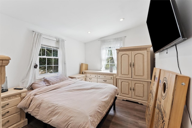 bedroom with recessed lighting, lofted ceiling, and dark wood-style flooring