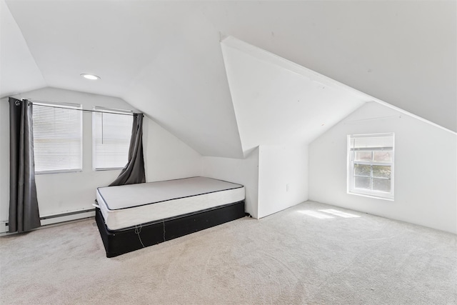 carpeted bedroom featuring recessed lighting, a baseboard radiator, and vaulted ceiling