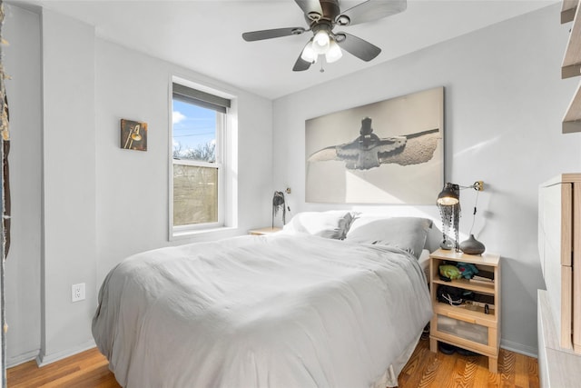 333 Bronx River Rd Unit 123, Yonkers, NY 10704 - bedroom featuring wood finished floors, ceiling fan, and baseboards