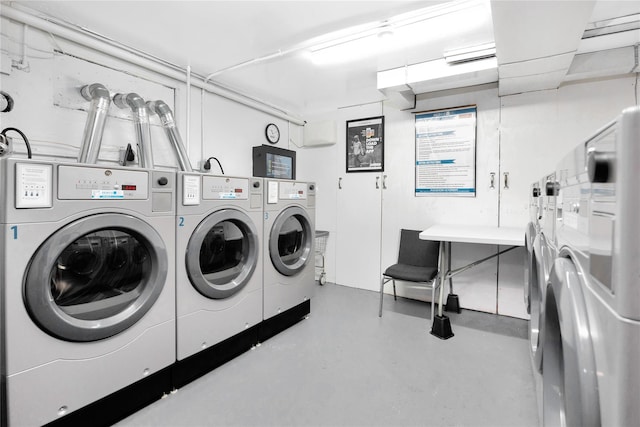 common laundry area with separate washer and dryer