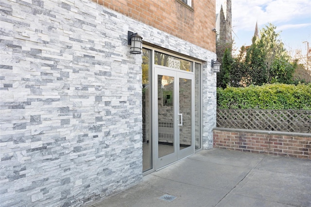 property entrance featuring french doors