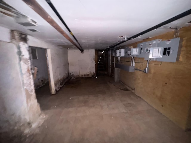 unfinished basement featuring electric panel