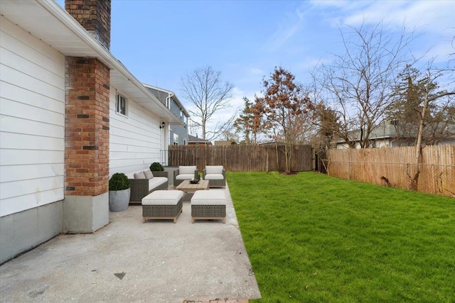 view of yard with a fenced backyard, an outdoor living space, and a patio