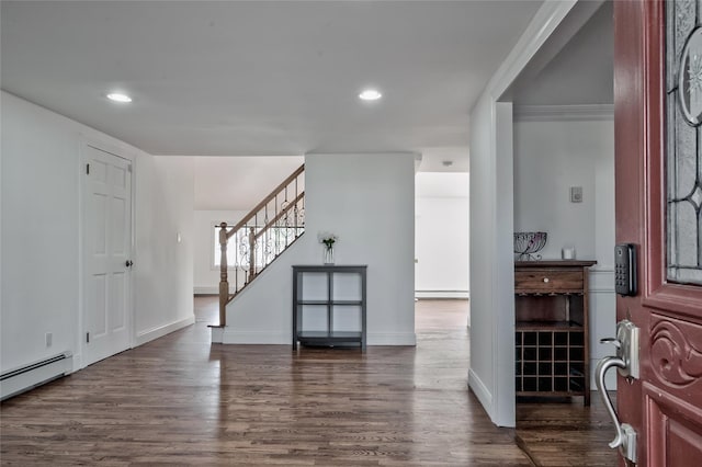 entryway featuring recessed lighting, a baseboard heating unit, stairs, and dark wood-style flooring