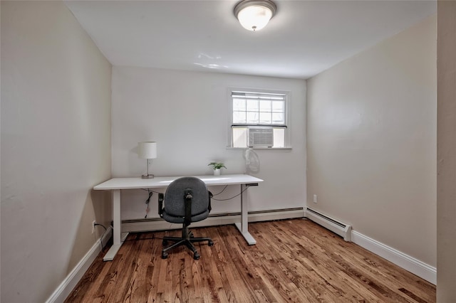 office area featuring cooling unit, baseboards, and wood finished floors