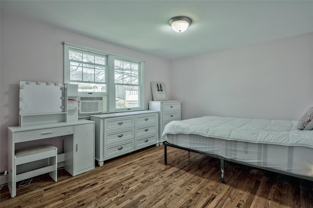 bedroom featuring dark wood finished floors and cooling unit