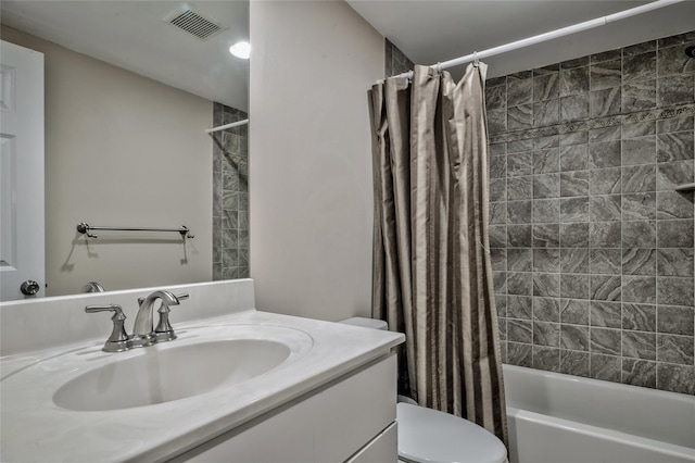 full bath featuring visible vents, vanity, toilet, and shower / tub combo with curtain