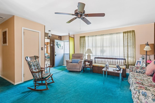 interior space featuring carpet and a ceiling fan