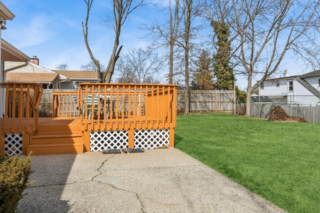 view of yard with a deck and fence