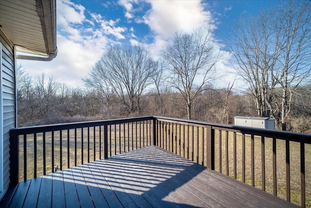 deck with a storage unit and an outdoor structure