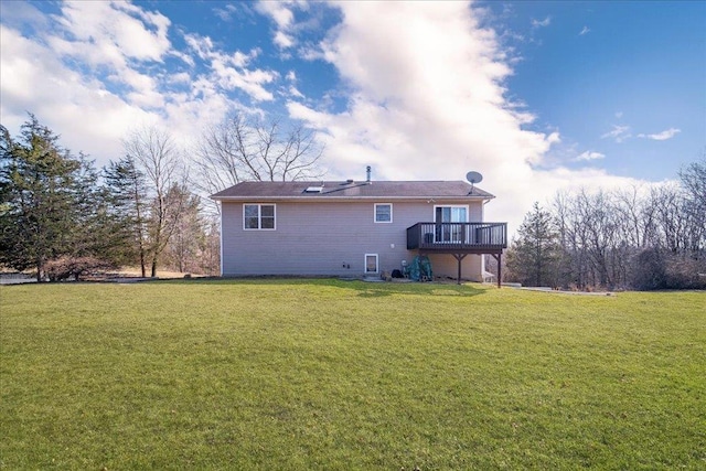 back of house featuring a wooden deck and a lawn