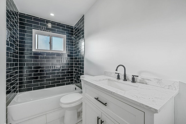 bathroom featuring toilet, shower / washtub combination, and vanity