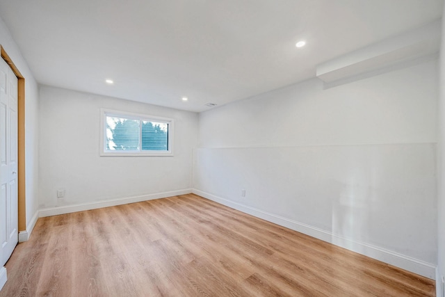 interior space with recessed lighting, light wood-type flooring, baseboards, and a closet