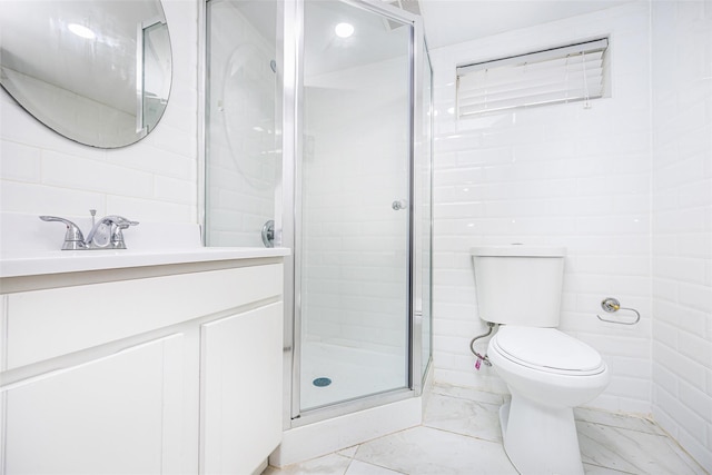 28-34 Corporal Kennedy St, Flushing, NY 11360 - bathroom with marble look tile flooring, vanity, a stall shower, and toilet