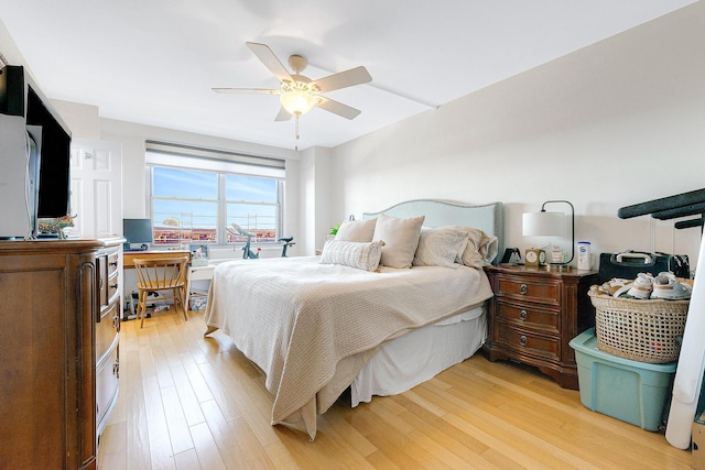 bedroom with light wood-style floors and ceiling fan