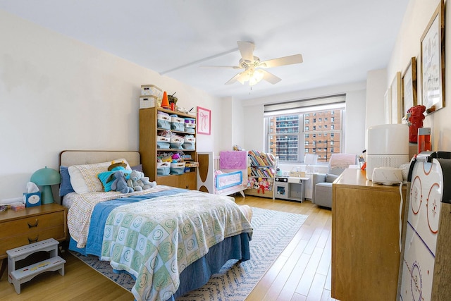 bedroom with wood finished floors and ceiling fan