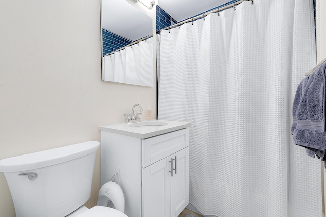 bathroom with toilet and vanity