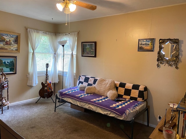 living room featuring a ceiling fan, carpet, and baseboards