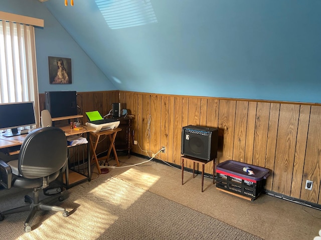 office area with lofted ceiling, wooden walls, a wainscoted wall, and tile patterned floors