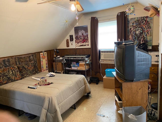 bedroom featuring wooden walls, ceiling fan, vaulted ceiling, cooling unit, and tile patterned floors