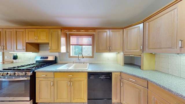 kitchen with tasteful backsplash, dishwasher, light countertops, gas stove, and a sink