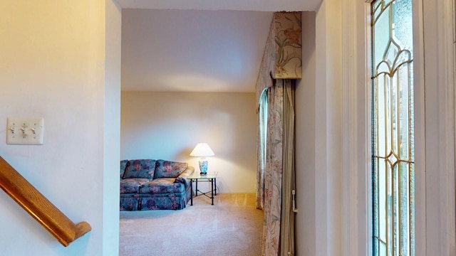 sitting room with a wealth of natural light and carpet