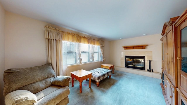 living area with light colored carpet and a fireplace