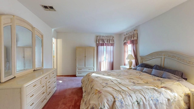 carpeted bedroom with visible vents