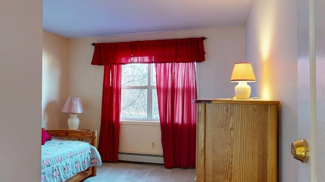 carpeted bedroom featuring baseboard heating