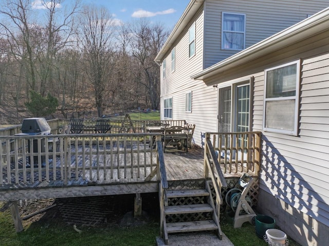 wooden terrace featuring outdoor dining area