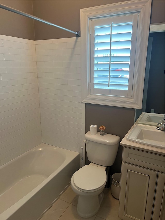 full bath featuring shower / bathing tub combination, toilet, vanity, and tile patterned flooring