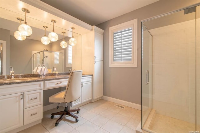 full bath with tile patterned floors, visible vents, a shower stall, baseboards, and vanity