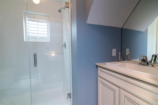 bathroom featuring a stall shower and vanity