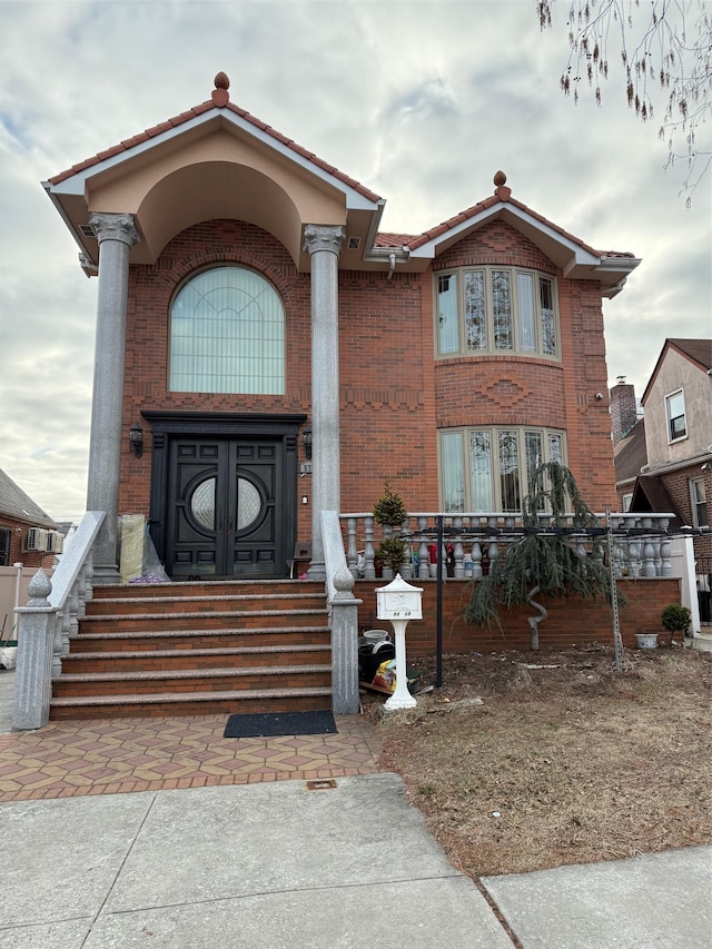 view of front of property featuring brick siding