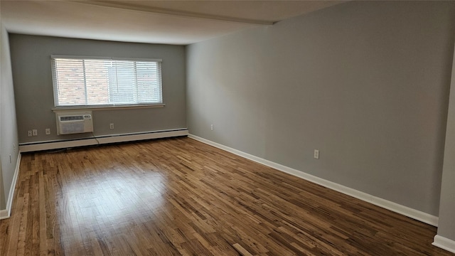 empty room featuring a wall mounted air conditioner, a baseboard heating unit, baseboards, and wood finished floors