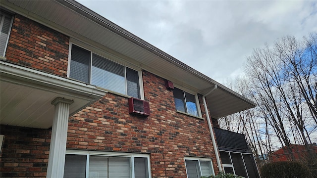 view of property exterior featuring brick siding