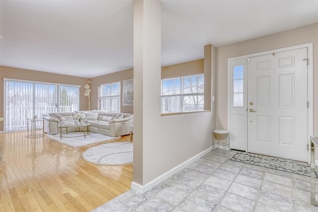 entryway featuring baseboards