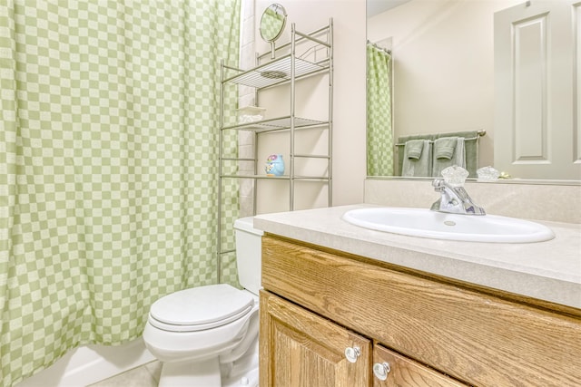 bathroom featuring curtained shower, toilet, and vanity