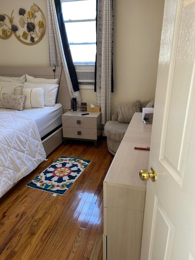 bedroom featuring dark wood-style flooring