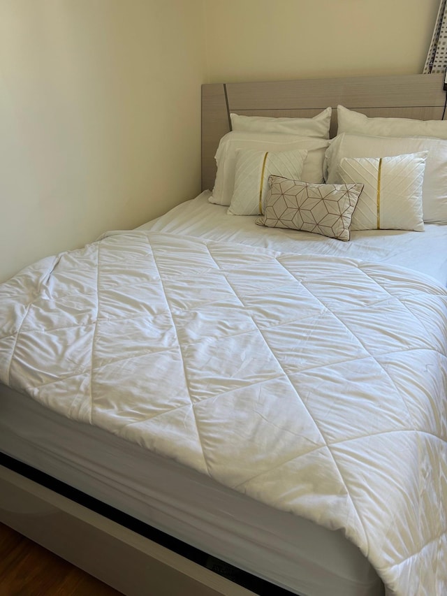 bedroom with wood finished floors